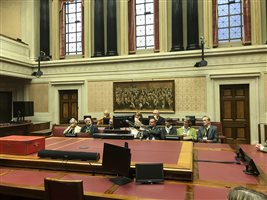 Committee Room with members' portraits in the background
